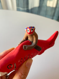 Clay doll - Monkey on the Koi fish!